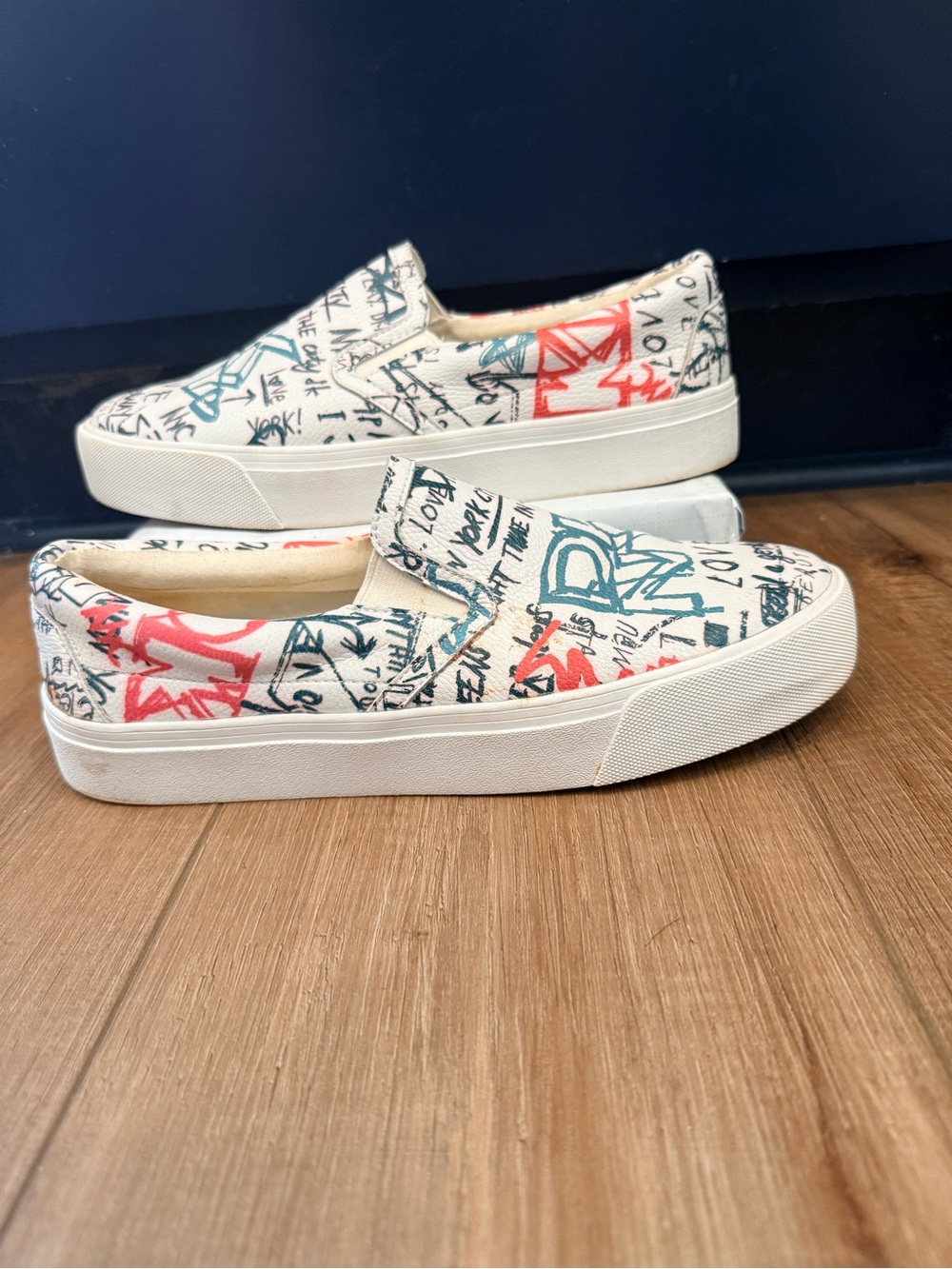 DKNY Case Sneakers in a vibrant, multi-colored graffiti print